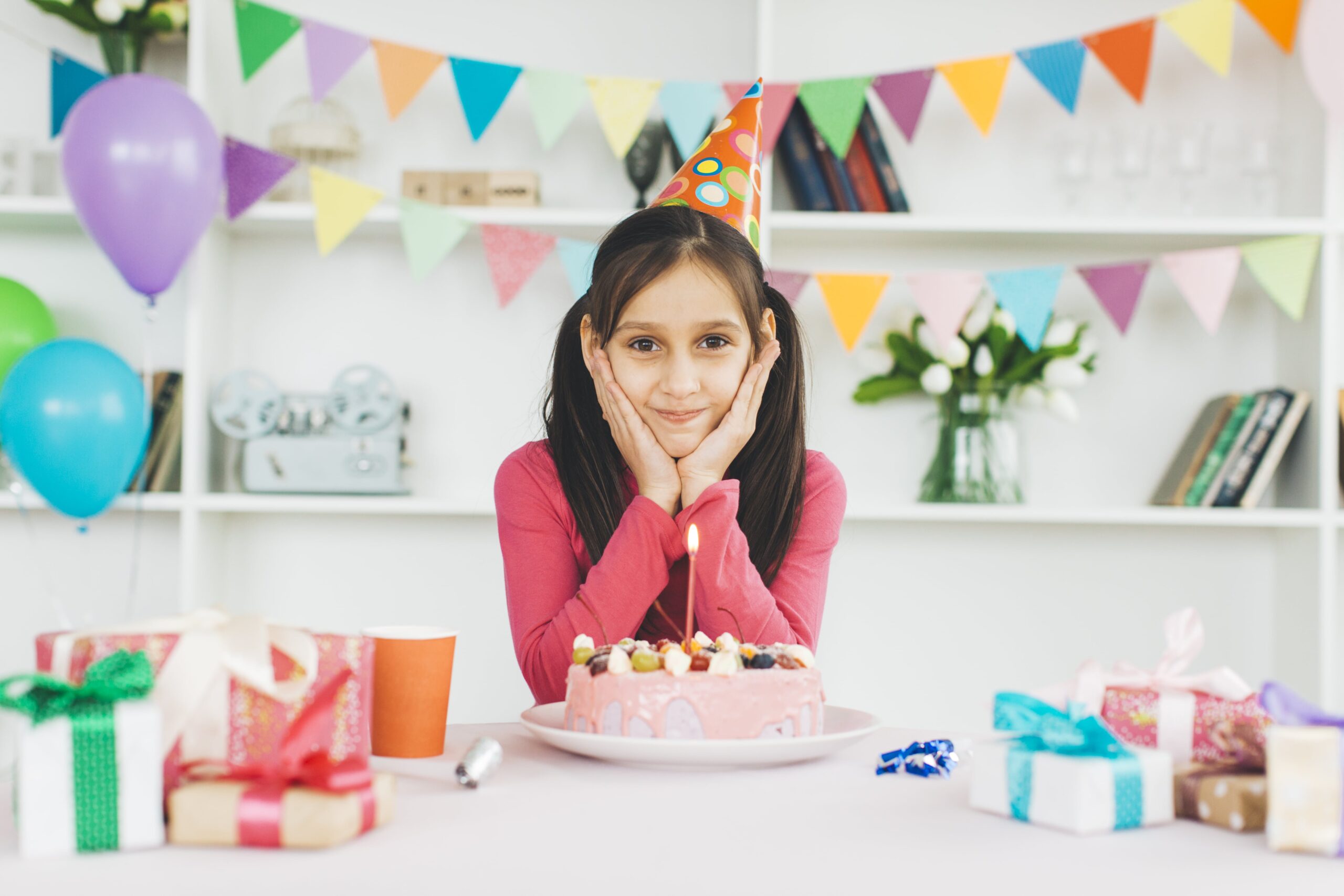 smiling-girl-with-birthday-cake-min